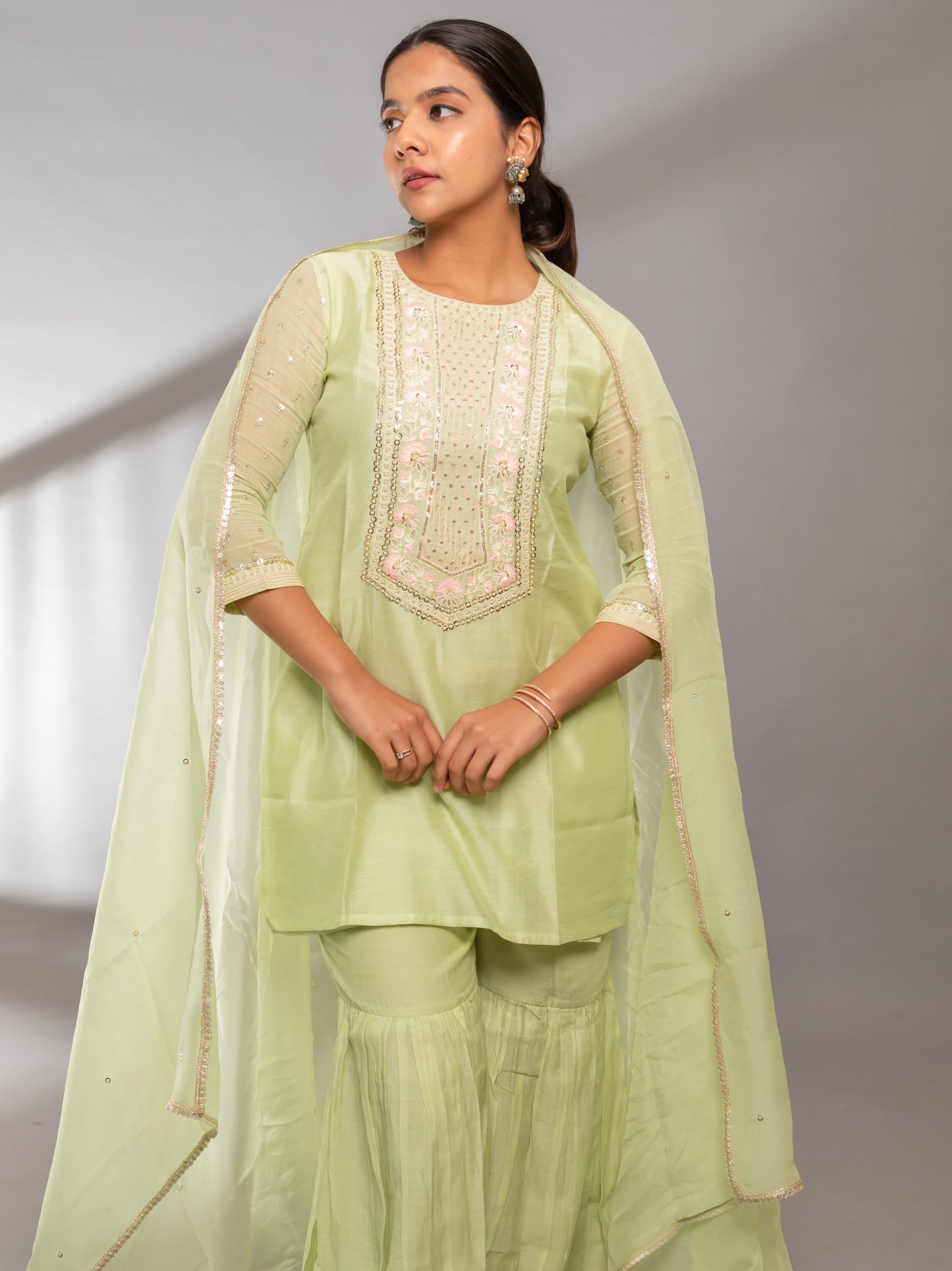 Ishtara's Elegant Indian outfit – pastel green hand-embroidered kurta with gharara