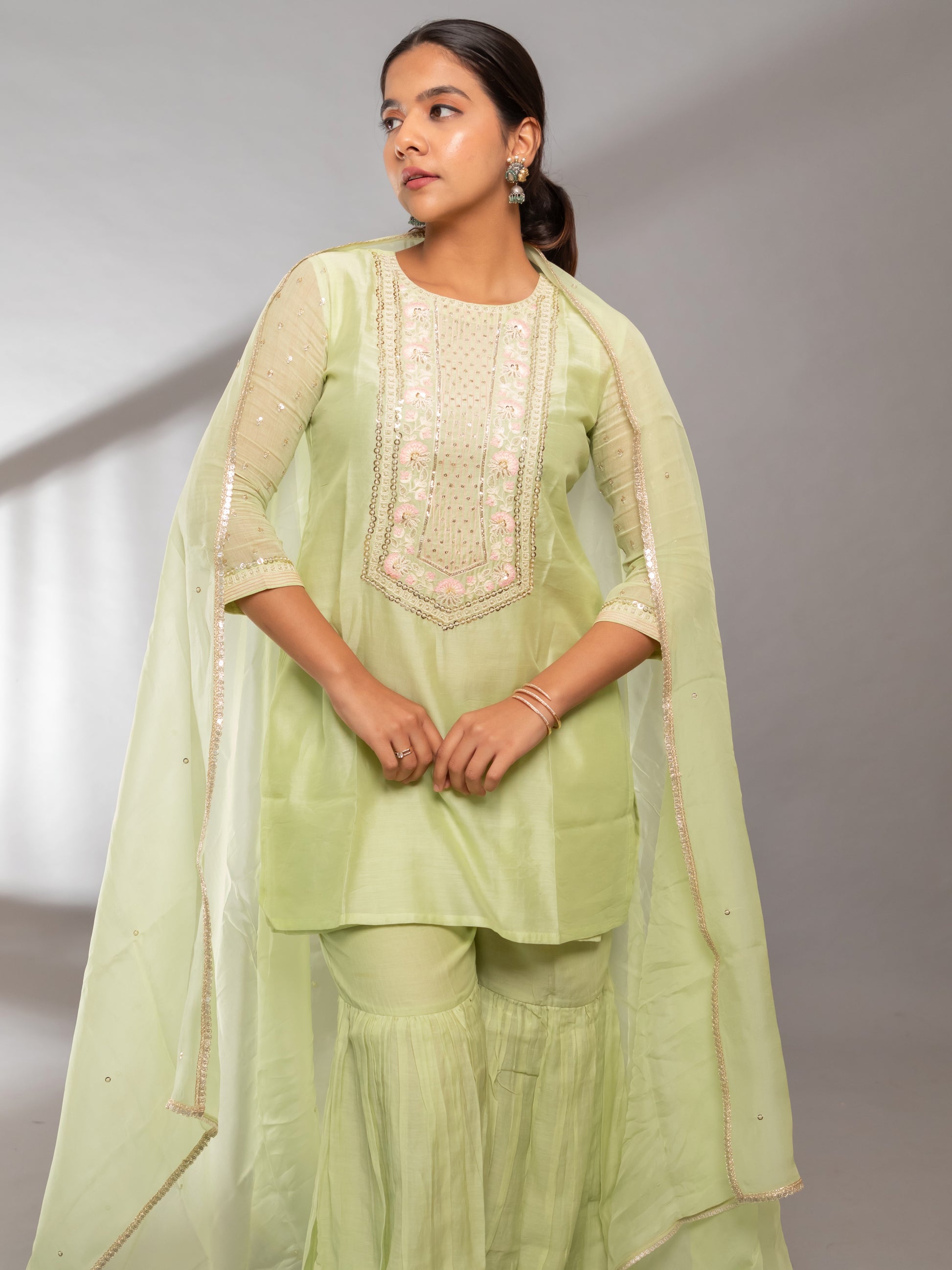 Ishtara's Elegant Indian outfit – pastel green hand-embroidered kurta with gharara